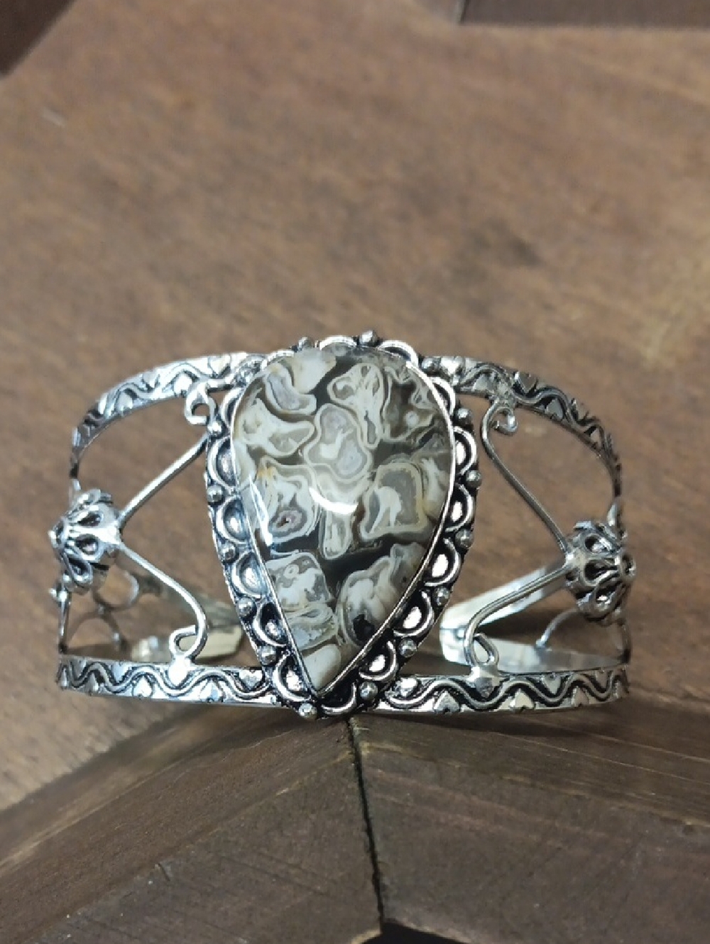 Silver Cuff Bracelet  Featuring An XL Cream, Gray And Black Teardrop Rock Fossil